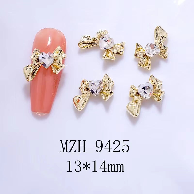 9425 Nail Golden Bow With Heart Stone